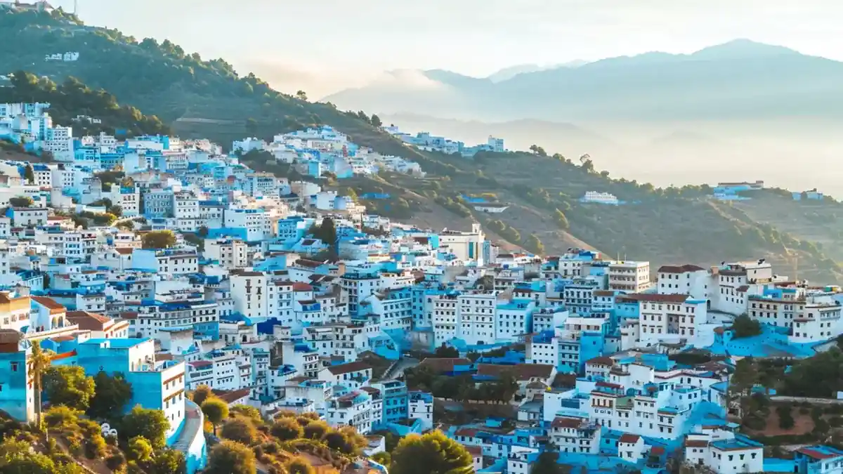 Panoramic view of Chefchaouen’s blue buildings cascading down a hillside
